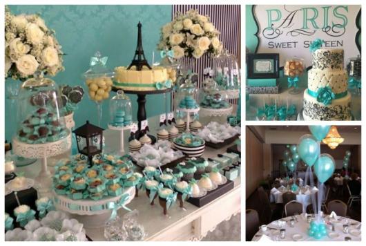 Montagem com decoração de mesa, bolo com detalhes em azul e bexigas da mesma cor.